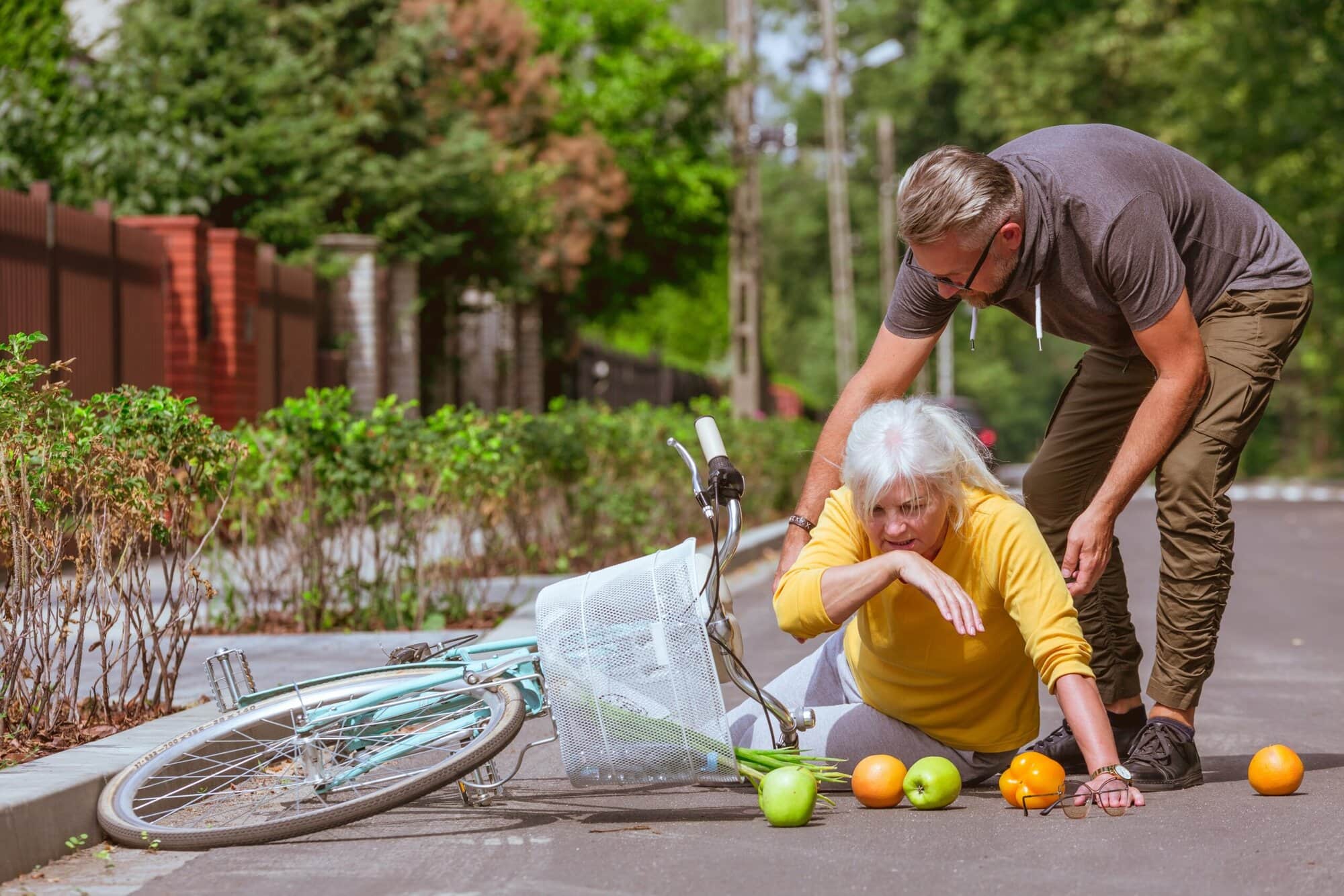 Woman on the strees falling down from bike Liability insurance is essential for expats living in the Czech Republic.
