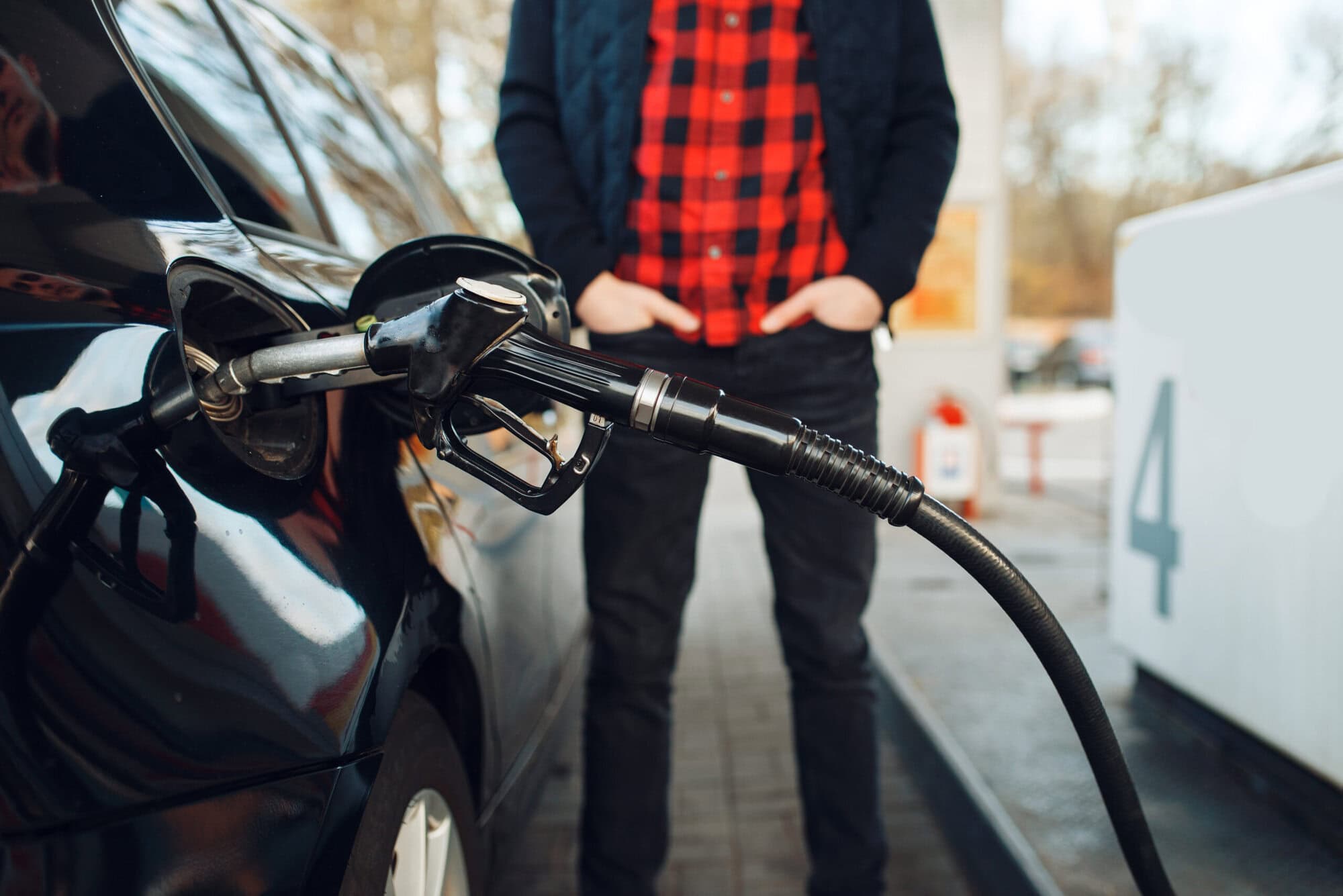 Man with gun fuels vehicle on gas station Czech households feel the gas prices caused by Iran war